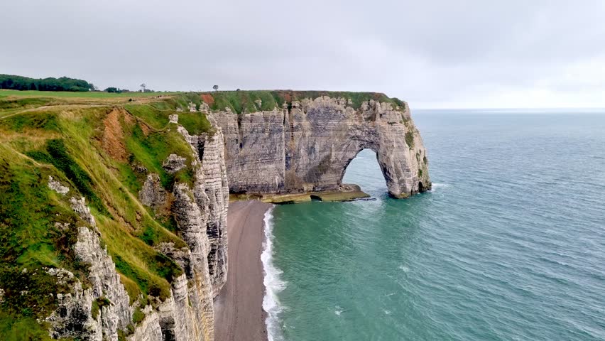Majestic Cliffs of Etretat on a Cloudy Day - Perfect for Coastal Landscape Designs