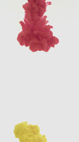 Vivid yellow paint dispersing in water against a fresh white backdrop, forming graceful swirling plumes—evoking fluid artistic beauty for creative motion design, visual effects, or ambient backgrounds