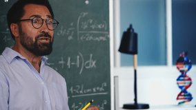 Furious math teacher breaking pencil while scolding students in classroom - Powered by Shutterstock - Get 15% off with code: PIKWIZARD15