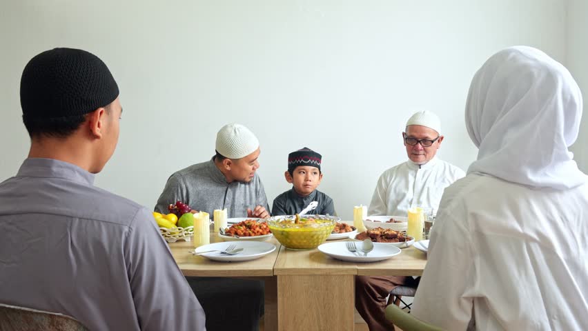 Happy Multi Generation Muslim Family Praying Together Before Having Lunch Together On Eid Moment