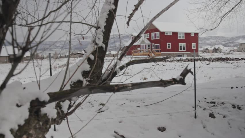 A country cottage after snow storm jib shot