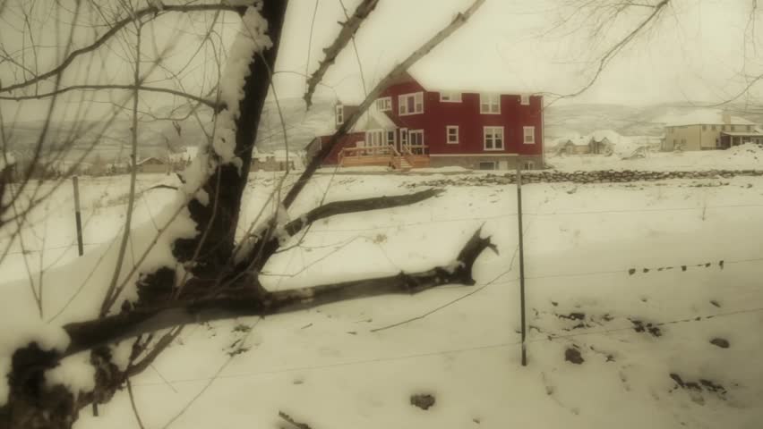 A country cottage after snow storm jib shot