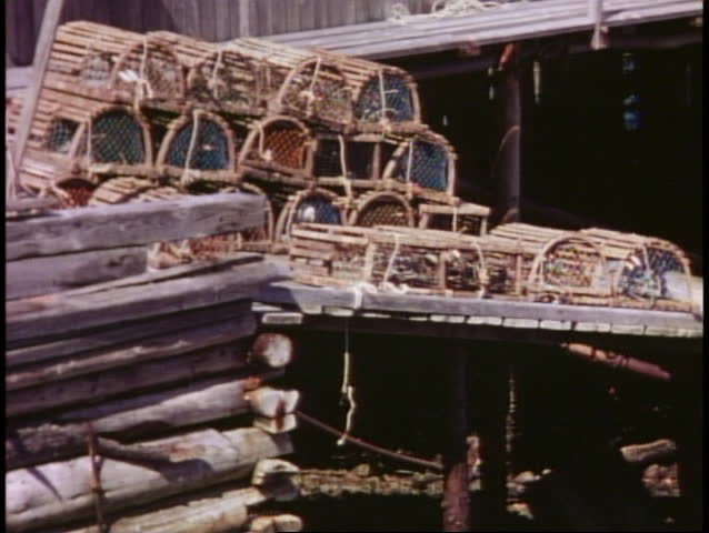 Lobster pots stacked on shore, wide shot, Bar Harbor, Maine