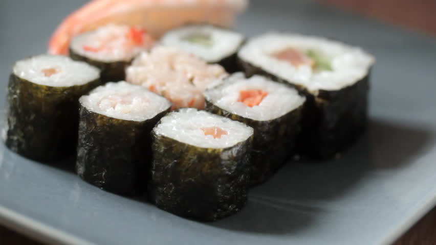 Taking sushi roll