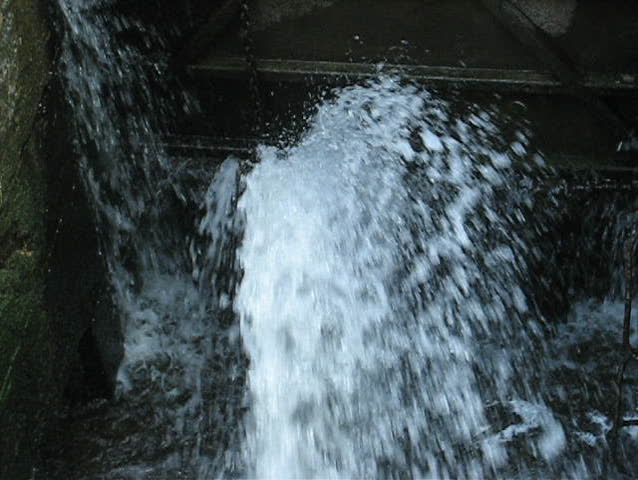 close up of waterfall, water coming towards camera