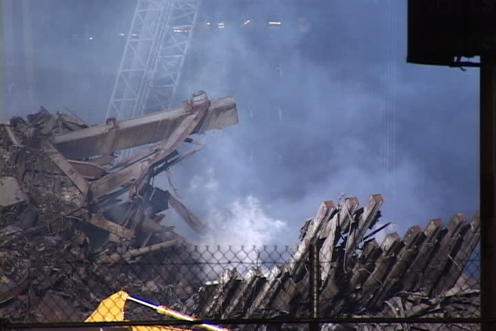 NEW YORK CITY - CIRCA SEPTEMBER 2001: Thick smoke rising from rubble at World Trade Center site.