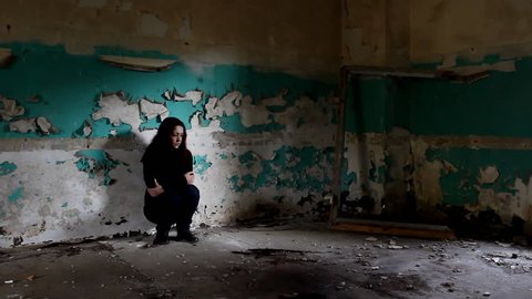 Woman in the deserted building.

