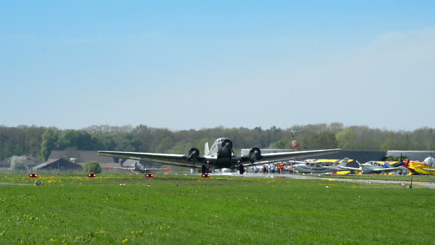 A historic airplane, Junkers JU 52 (Nickname "Tante JU") roll on airport taxiway. No recognizable people, trademarks or logos!  