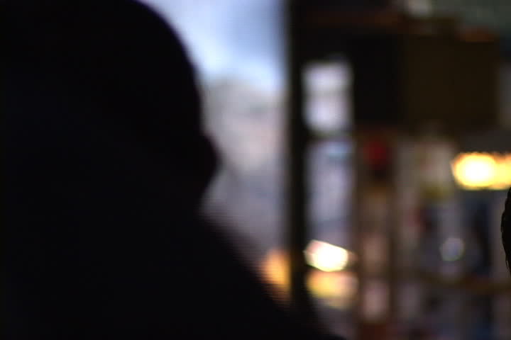 NEW YORK CITY - SEPTEMBER 28, 2001: Smoking rubble seen over the shoulder of a silhouetted spectator at World Trade Center site.