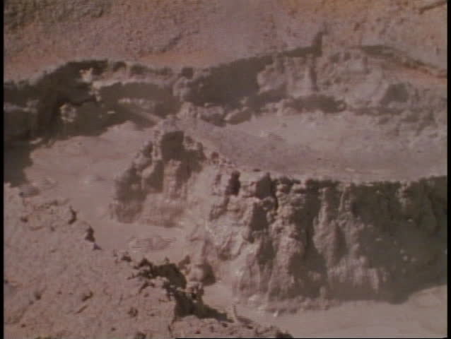 Yellowstone National Park, paint pots, gray bubbling mud, medium close up