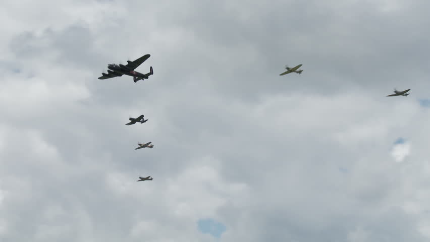 Avro Lancaster bomber flying in formation with RAF Spitfires, a Hurricane and a