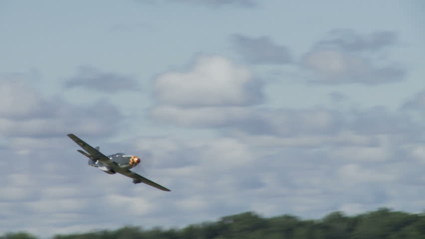Two clips of a historic USAF P-51 Mustang flying low.