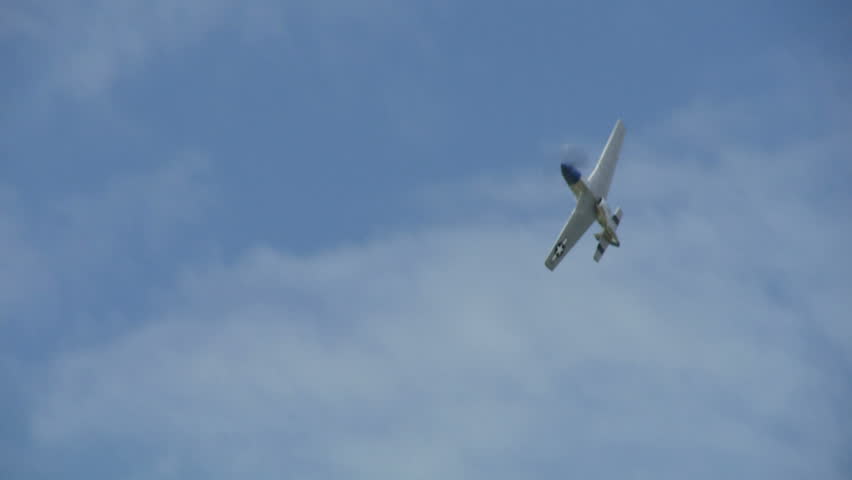 Historic USAF P-51 Mustang performing aerobatics.  Recorded in slow motion at