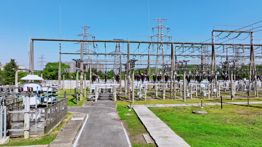 aerial view electric substation, pylon power line high voltage, electrical transmission field,