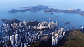 Cinematic aerial view of Hong Kong skyline shrouded in mist at blue hour, with glowing skyscrapers and Victoria Harbour fading into a moody, atmospheric twilight - Powered by Shutterstock - Get 15% off with code: PIKWIZARD15