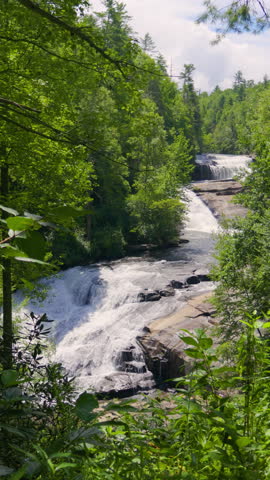 Vertical Video. Beautiful Waterfall in Appalachian Mountains National Park North Carolina. Fall of Water Nature Wild. North Carolina Cascade Waterfall in Appalachian Mountains Surrounded by Green Fore