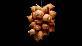 Cluster of ripe salak fruits rotating in a seamless loop against black background with dramatic lighting, shot in close-up, Exotic Fruit Concept. - Powered by Shutterstock - Get 15% off with code: PIKWIZARD15