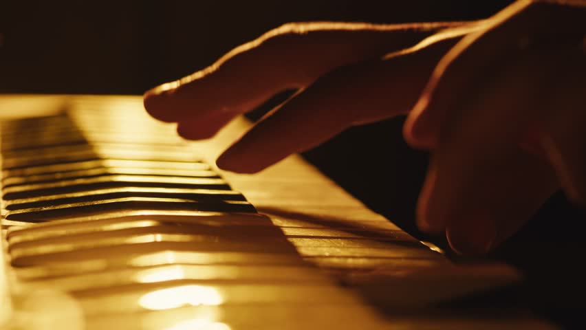 Playing piano vintage retro synthesizer. Close up of man hands playing jazz on the piano. Fingers on the piano, vintage colors. A very close look at a jazz pianist hands. Man playing the piano, close