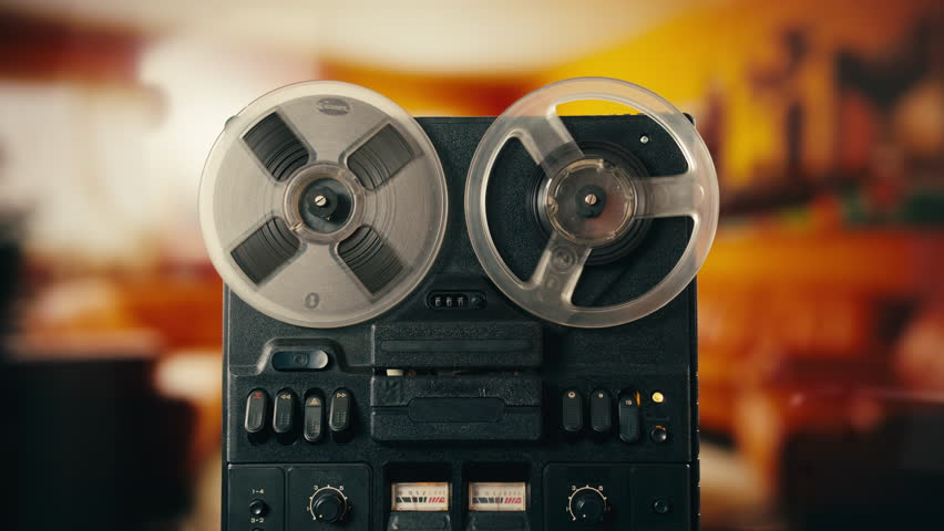 Tape audio music player, studio magnetic tape, vintage retro spool reel to reel player and recorder, magnetic tape data storage close up, music studio. 