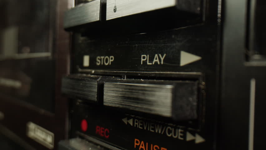 Retro radio tape recorder, audio cassette close-up. Listening to music, old radio boom box player, macro of vintage music listening. 