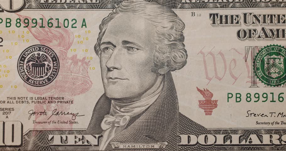 US President Hamilton on United States. American ten dollar paper banknote zoom in close up macro. Ten USD cash macro view. Rich business economy of usa. Finance Business Investment Success. Ten USD.