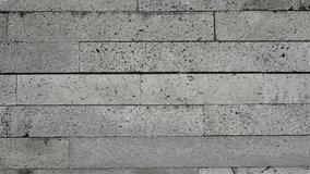 Detailed close-up image of a concrete stone brick wall texture, perfect for backgrounds, construction themes, or design projects. Close-Up of Concrete Stone Brick Wall Texture for Background - Powered by Shutterstock - Get 15% off with code: PIKWIZARD15