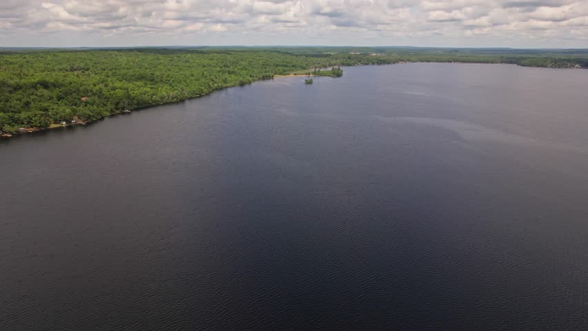 Canadian vacation Crowe Lake, beautiful landscape in summer day with very cloudy sky. Epic panoramic water and vegetations view from above, Marmora town and Kawartha lakes, Ontario, Canada