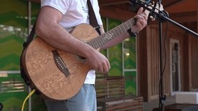 Guitarist performing live music outdoors - Powered by Shutterstock - Get 15% off with code: PIKWIZARD15