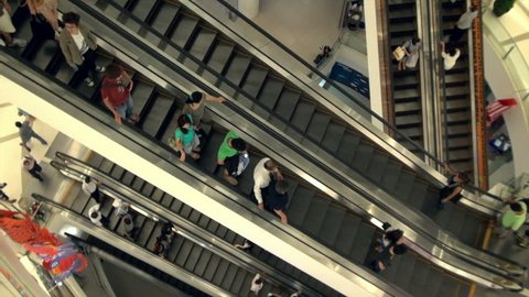 BANGKOK / THAILAND - CIRCA JUNE 2011 - Busy escalators in Siam Paragon shopping mall in Bangkok.