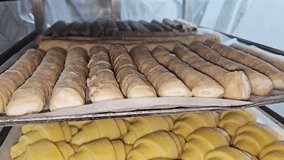 Dough croissants, puffs, borek, raw, on a wire rack, ready to bake. Pastries for a bakery.
 - Powered by Shutterstock - Get 15% off with code: PIKWIZARD15