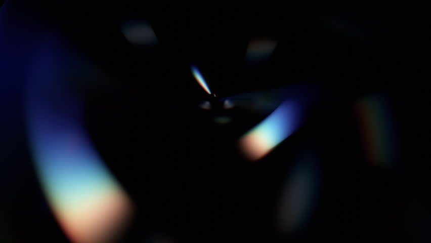 Abstract animation, dark background with color refraction effect, 4k seamless looping video, 3d render