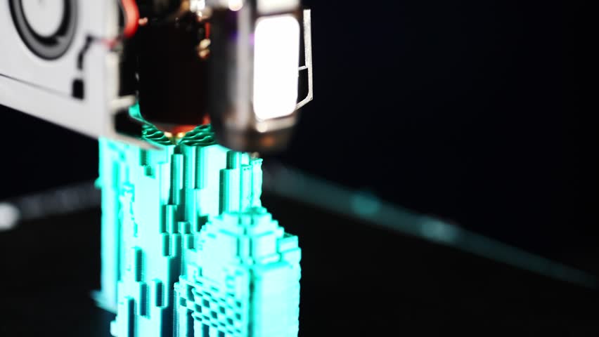 High quality close up of professional 3D printer producing a detailed object using state of the art additive manufacturing technology and precise layer deposition. High quality 4k footage