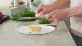 4K closeup video of male hands grating fresh cheese over plate with hot fluffy omelette eggs for breakfast on rustic table Gourmet food preparation healthy eating lifestyle, protein nutrition concept - Powered by Shutterstock - Get 15% off with code: PIKWIZARD15
