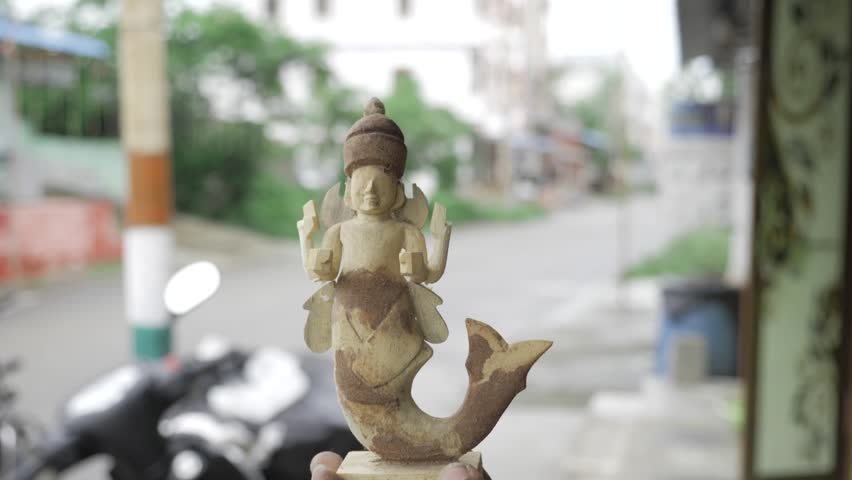 Hand-Held Elegance - A Whimsical Wooden Mermaid Sculpture