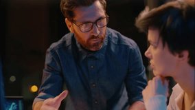 Night office business man woman working together Caucasian businessman businesswoman co-workers teamwork crypto trading online computer project mentoring employees cooperation trade evening overtime - Powered by Shutterstock - Get 15% off with code: PIKWIZARD15