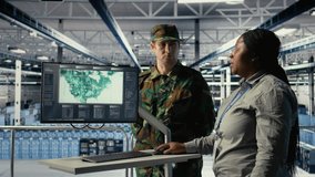 Team of military specialists in data center looking at world map on screen, coordinating mission zones. Army colleagues in server hub looking at global map to plan battlefield operations, camera A - Powered by Shutterstock - Get 15% off with code: PIKWIZARD15