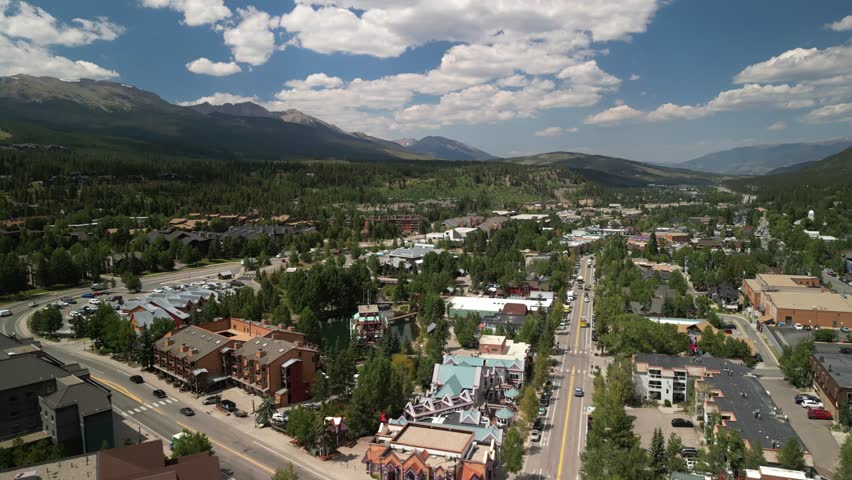 Aerial above Breckenridge Colorado ski town in summer on sunny day