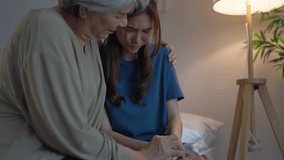 Asian elderly mother comforting upset daughter crying for life problem. Caring senior mature mom support, consoling and understand empathy to stressed young woman in tears at home. Family relationship - Powered by Shutterstock - Get 15% off with code: PIKWIZARD15