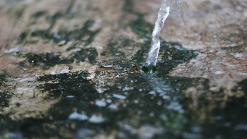close up of water fountain during rain