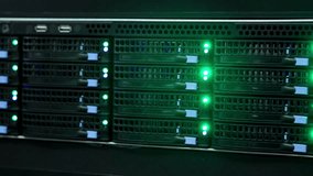 Server rack blinking green lights in data center. Media - Powered by Shutterstock - Get 15% off with code: PIKWIZARD15