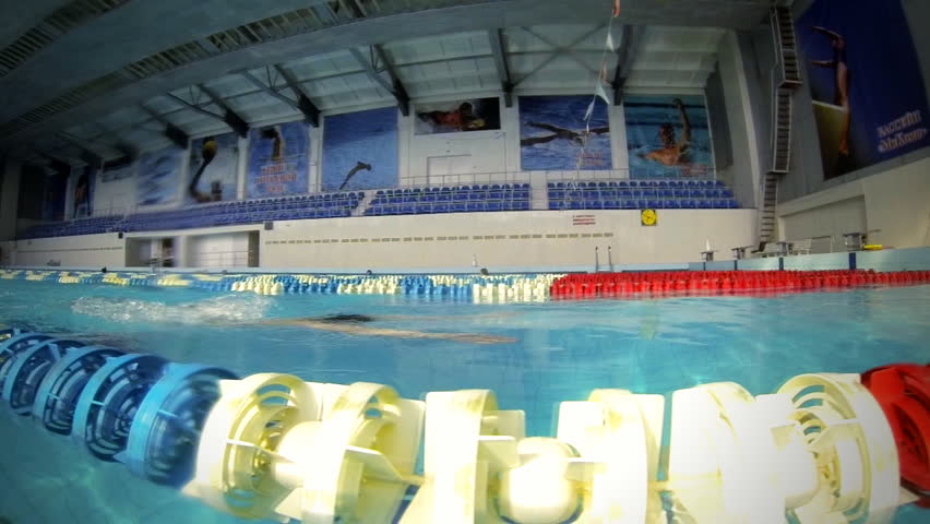 Beautiful slow motion view of athlete swimming breaststroke style