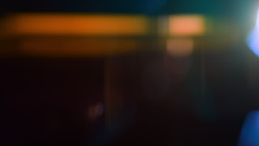 Real Shooted Anamorphic Lens Flare Transition on Black Background in Super Slow Motion.