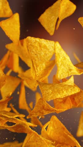 Super slow motion of flying fried tortilla chips with camera movement . Filmed on high speed cinema camera at 1000 fps
