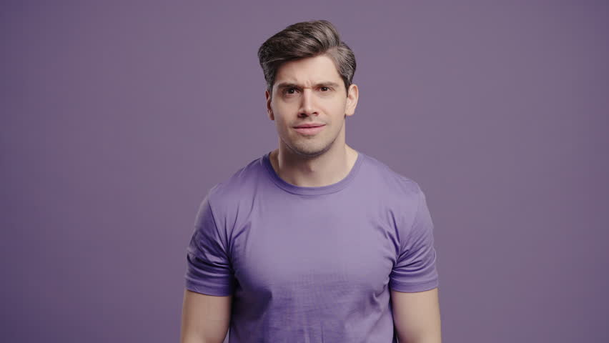 Mature man shrugs shoulders showing uncertainty, confusion, dilemma, hesitation