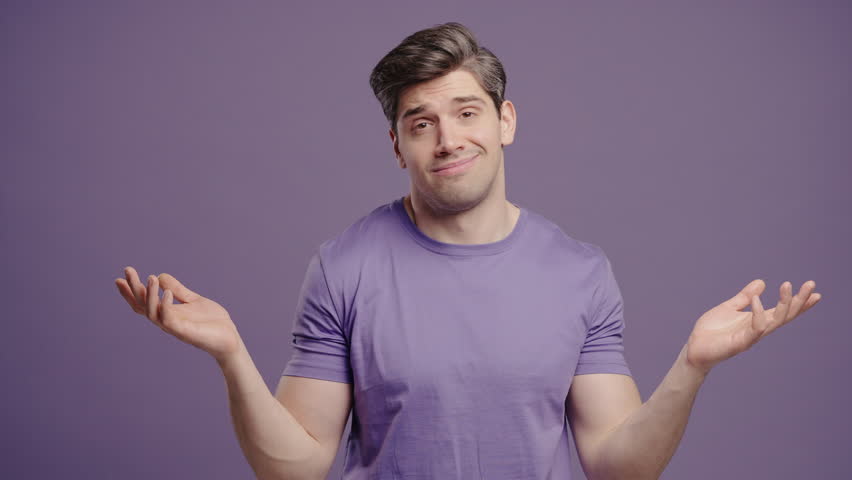 Mature man shrugs shoulders showing uncertainty, confusion, dilemma, hesitation