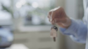 Hand of real estate agent handing over house keys to homeowner after successful deal in office. Close-up view - Powered by Shutterstock - Get 15% off with code: PIKWIZARD15