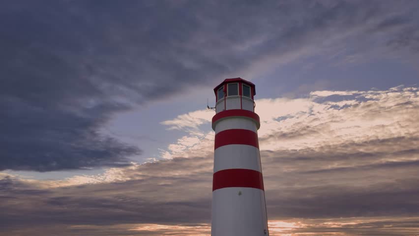 Lighthouse on Neusiedler See, Austria, bathed in the first warm rays of sunset. Calm lake reflects soft evening light, creating a serene and magical atmosphere.