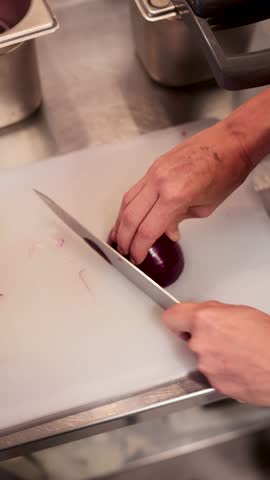 Woman preparing a fresh salad in the kitchen
