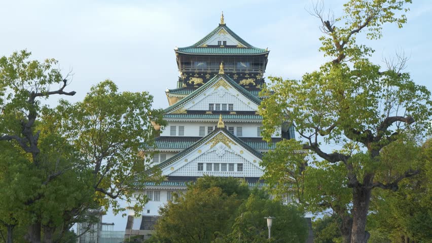 Famous Ornate Tiered Main Tower Of Osaka Castle In Japan. Static Shot