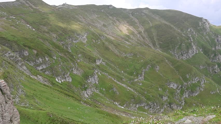 Scenic view of a beautiful landscape of high altitude mountain, with a very deep (400 m deep) and steep valley